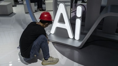 AI governance will emerge through repeated bargains over access, safety and public use. [Photo credit: Bloomberg]