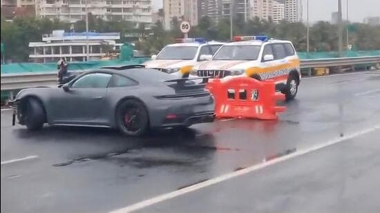 A luxury Porsche crashed into a barricade on Mumbai’s Coastal Road on Sunday morning