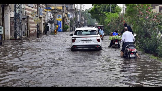 A waterlogged road in Transport Nagar after the rain in Ludhiana on Sunday. (GURPREET SINGH/HT)
