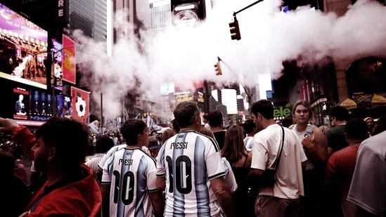 Argentina fans wearing Lionel Messi jerseys walk around New York ahead of the Fifa World Cup 2026 final against Spain, at Times Square in New York City.