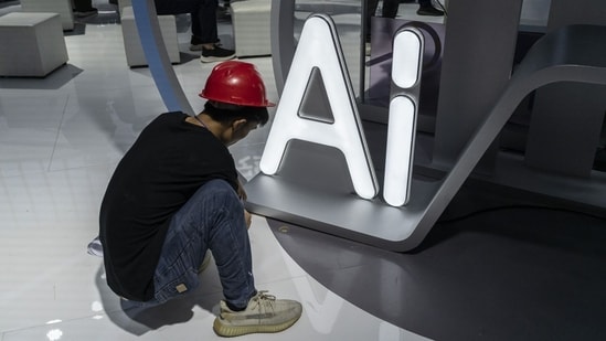 AI governance will emerge through repeated bargains over access, safety and public use. [Photo credit: Bloomberg]
