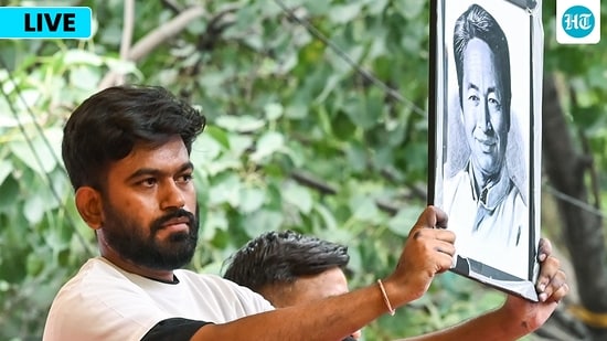 Sonam Wangchuk news LIVE: CJP founder Abhijeet Dipke with a portrait of environmentalist Sonam Wangchuk after the latter's hospitalisation and announcement of former's hunger strike.(ANI)