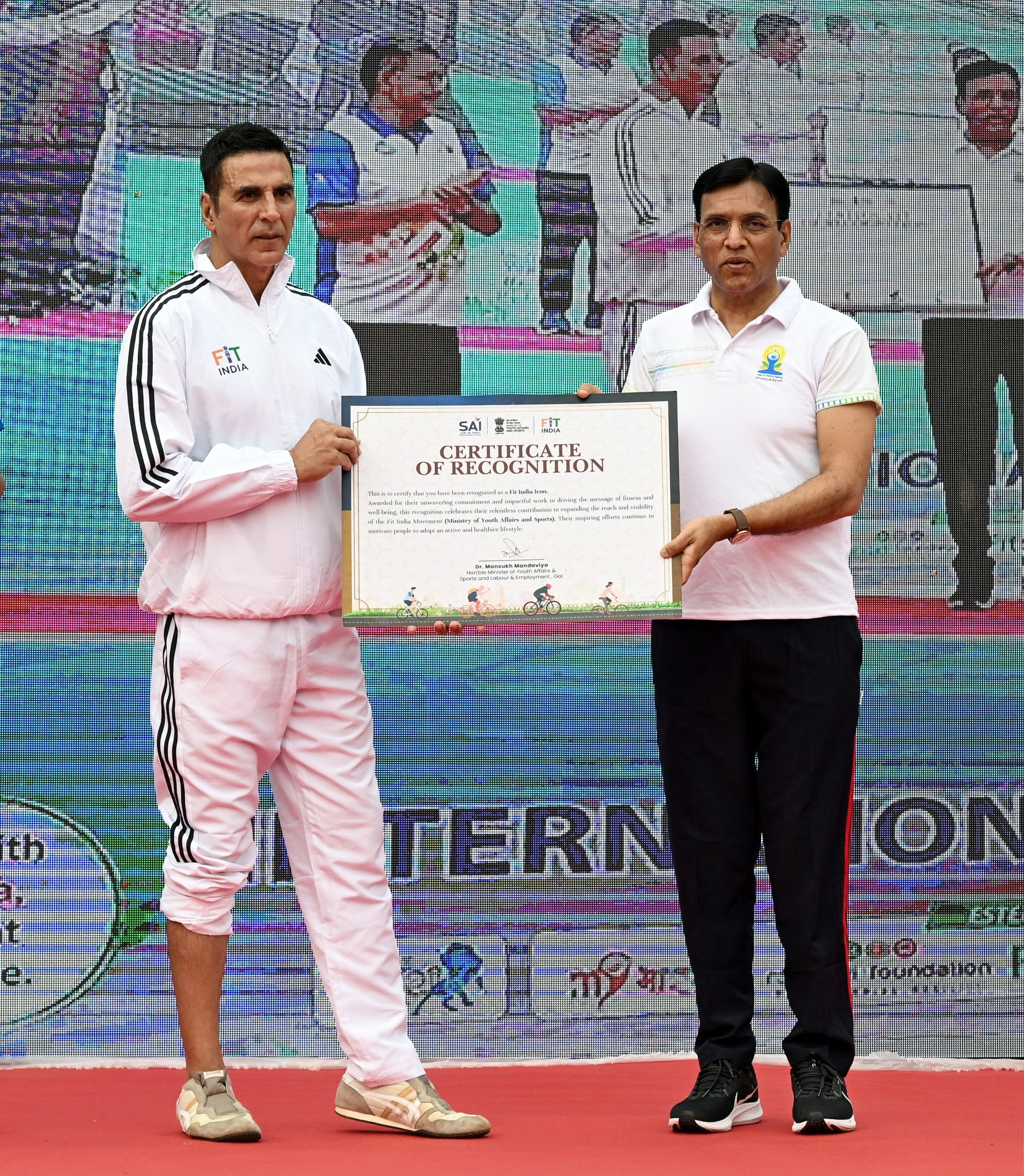 Union Minister for Youth Affairs and Sports Mansukh Mandaviya presents a certificate to Bollywood actor Akshay Kumar on the occasion of the 12th International Day of Yoga. (Jitender Gupta)
