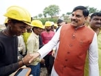 Madhya Pradesh Chief Minister Mohan Yadav interacts with workers during his inspection of the Sleemanabad Tunnel, India’s longest water tunnel, in Katni on Friday.