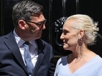 Britain's new Prime Minister Andy Burnham and his wife Marie-France van Heel pose on the steps of 10 Downing Street in central London on July 20, 2026, after being asked by the king to form the next government. (Photo by Henry NICHOLLS / AFP)