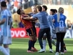 Argentina's head coach Lionel Scaloni (C,R) tries to intervene as Argentina's midfielder #05 Leandro Paredes clashes with Spain's defender #04 Eric Garcia. 