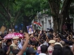 Cockroach Janata Party (CJP) supporters raise slogans, near Jantar Mantar, ahead of a protest march, in New Delhi, early Monday,