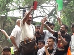 Prakash Raj waves the Constitution at the Chalo Sansad march.