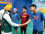 Punjab chief minister Bhagwant Mann interacting with badminton players at Raizada Hansraj Stadium in Jalandhar. (HT Photo)