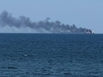 Smoke rises from a civilian vessel on fire, amid Russia's attack on Ukraine, in Odesa, Ukraine July 19, 2026.Picture taken with a mobile phone. (REUTERS)