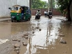 The dilapidated road with potholes and poor drainage in Giaspura , Ludhiana, on Sunday. (Manish/HT)