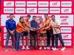 Dr. Ajay R. Gaude, Executive Director, Sports Authority of Goa, presents the Dream UTT Juniors Season 2 Champions Trophy to U Mumba's Somdev Sengupta and Ahona Ray, alongside the team CEO Suhail Chandhok, in the presence of Neel Shah, CEO, Dream Sports Foundation