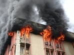 Fire fighters douse the  fire broke out on the fourth floor of Jawahar Bhawan building in Lucknow on Monday, July 20, 2026. 