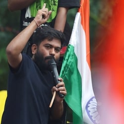 Abhijeet Dipke, head of the Cockroach Janta Party (CJP) addresses supporters at a protest site ahead of a planned march to Parliament on the opening day of the monsoon session.