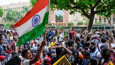 RJD supporters raise slogans during a protest march near Parliament, outside the Reserve Bank of India building in New Delhi. (PTI) RJD supporters raise slogans during a protest march near Parliament, outside the Reserve Bank of India building in New Delhi. (PTI)