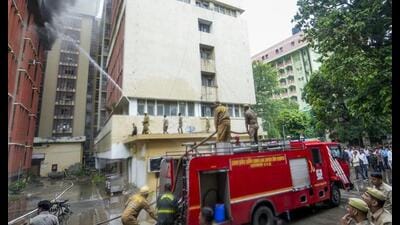 Fire personnel conduct a dousing operation after fire broke out at the 12-storey Jawahar Bhawan government building, in Lucknow, on Monday. (PTI Photo) Fire personnel conduct a dousing operation after fire broke out at the 12-storey Jawahar Bhawan government building, in Lucknow, on Monday. (PTI Photo)