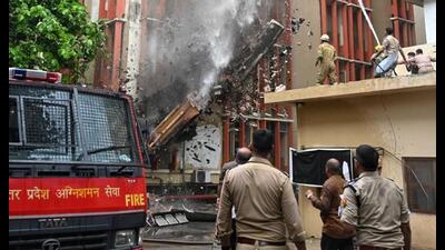 Firefighters douse the blaze on the fourth floor of the building at the Jawahar Bhawan complex in Lucknow on Monday. (HT Photo) Firefighters douse the blaze on the fourth floor of the building at the Jawahar Bhawan complex in Lucknow on Monday. (HT Photo)
