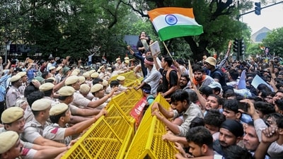 Activists and supporters of the Cockroach Janta Party (CJP) clashed with police personnel during a protest demanding the resignation of Indian Education Minister Dharmendra Pradhan over alleged irregularities in NEET exams in New Delhi. (AFP) Activists and supporters of the Cockroach Janta Party (CJP) clashed with police personnel during a protest demanding the resignation of Indian Education Minister Dharmendra Pradhan over alleged irregularities in NEET exams in New Delhi. (AFP)