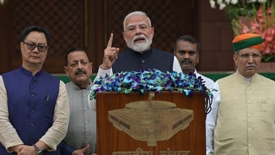 Prime Minister Narendra Modi, centre, arrives with members of his cabinet to address the media outside the Parliament building on the opening day of the monsoon session. (AP Photo/Sanjeev Rastogi) Prime Minister Narendra Modi, centre, arrives with members of his cabinet to address the media outside the Parliament building on the opening day of the monsoon session. (AP Photo/Sanjeev Rastogi)