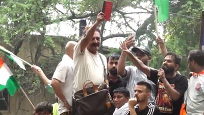 Prakash Raj waves the Constitution at the Chalo Sansad march. (PTI) Prakash Raj waves the Constitution at the Chalo Sansad march. (PTI)