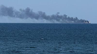 Smoke rises from a civilian vessel on fire, amid Russia's attack on Ukraine, in Odesa, Ukraine July 19, 2026.Picture taken with a mobile phone. (REUTERS) Smoke rises from a civilian vessel on fire, amid Russia's attack on Ukraine, in Odesa, Ukraine July 19, 2026.Picture taken with a mobile phone. (REUTERS)