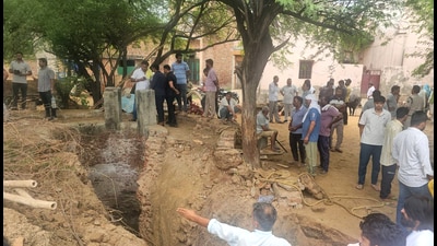 Villagers gathered at the abandoned well in Munimpur village in Jhajjar on Monday. (Manoj Dhaka/HT) Villagers gathered at the abandoned well in Munimpur village in Jhajjar on Monday. (Manoj Dhaka/HT)