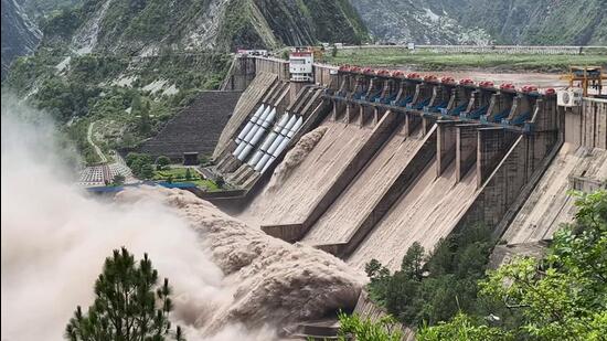 A view of the multiple opened spillway gates of the Salal Dam amid rising Chenab River water level, in Reasi on Sunday (ANI video Grab)