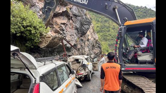 Rescue operation underway after falling boulders struck a passenger bus and vehicle, killing two persons and leaving six others injured, near Raggi Nallah on NH 244, in Doda on Monday. (PTI)