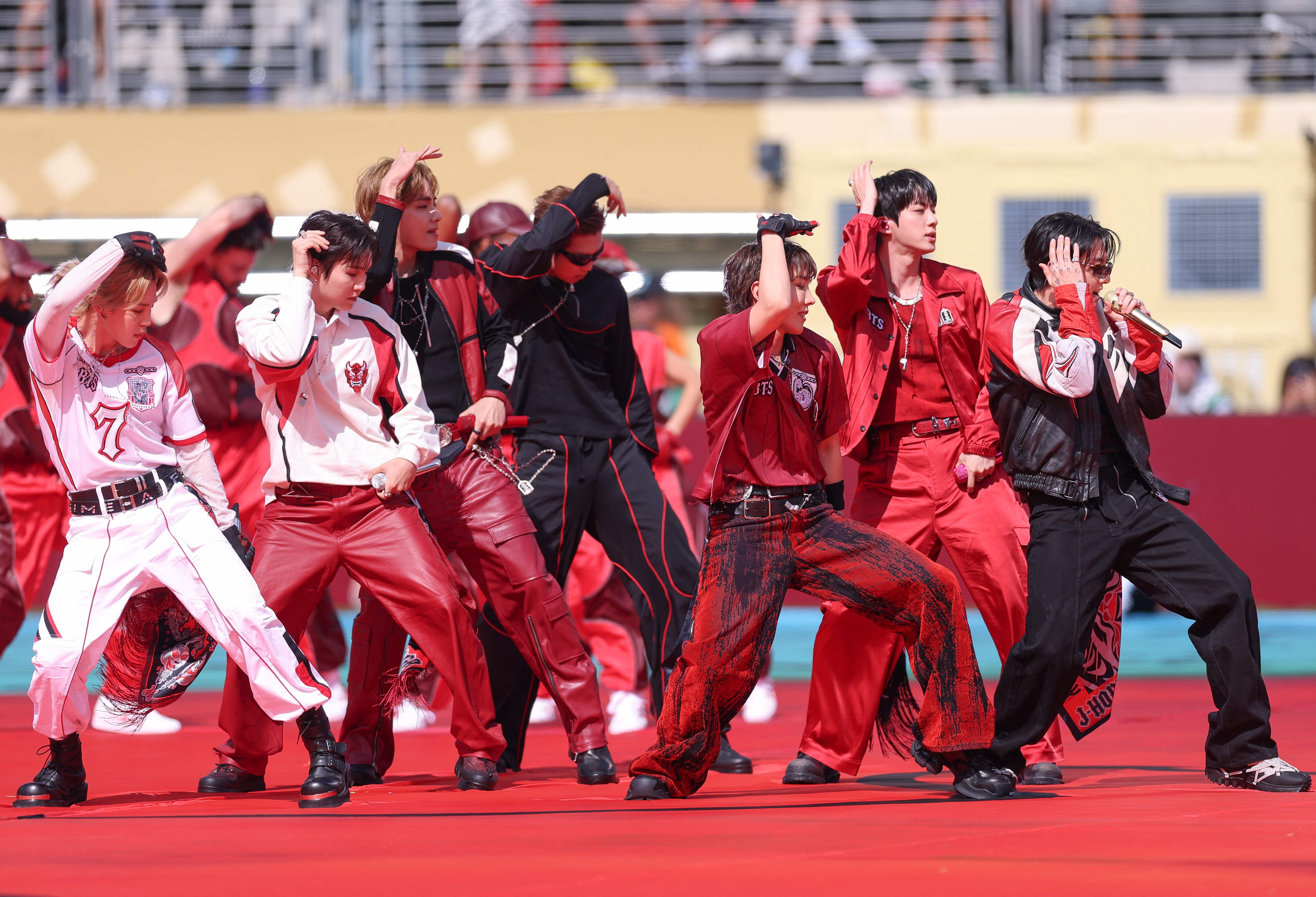(L-R) Jimin, Suga, V, RM, J-Hope, Jin and Jungkook of BTS during the Topps Final Halftime Show at the FIFA World Cup 2026 Final match between Spain and Argentina at New York New Jersey Stadium on July 19, 2026 in East Rutherford, New Jersey.   Carl Recine/Getty Images/AFP (Getty Images via AFP)