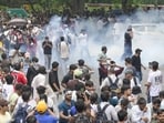 Agitators marched to Parliament demanding the resignation of Union education minister Dharmendra Pradhan over exam irregularities. (HT PHOTO)