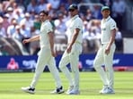 Pat Cummins walks back to the Lord's Pavilion with Josh Hazlewood.