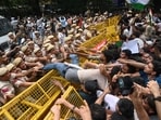 Supporters of the Cockroach Janta Party scuffle with police as they attempt to march toward India's Parliament, demanding the resignation of the education minister, in New Delhi, Monday, July 20, 2026.