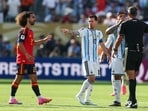 Lionel Messi points at Marc Cucurella as Slovenian referee Slavko Vincic and Enzo Fernandez argue during the 2026 World Cup final