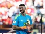 Spain's goalkeeper #23 Unai Simon receives the Golden Glove Award during the award ceremony of the 2026 World Cup football tournament final match