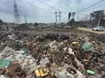 Industrial waste dump in the road side area and green belt in focal point in Ludhiana on Tuesday. (Gurpreet Singh/HT)