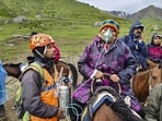 Mountain Rescue Team officials assist pilgrims during the annual Yatra. (PTI)