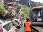 Rescue operation underway after falling boulders struck a passenger bus and vehicle, killing two persons and leaving six others injured, near Raggi Nallah on NH 244, in Doda on Monday. (PTI)