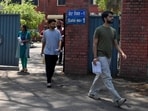 Candidates exit an examination centre.