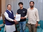 Union Minister JP Nadda, left, meets Cockroach Janta Party (CJP) spokespersons Saurav Das and Ashutosh Ranka amid an ongoing protest by CJP over the alleged NEET paper leak, in New Delh.