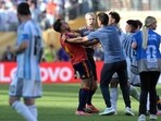 Lionel Scaloni tries to intervene as Leandro Paredes clashes with Eric Garcia.