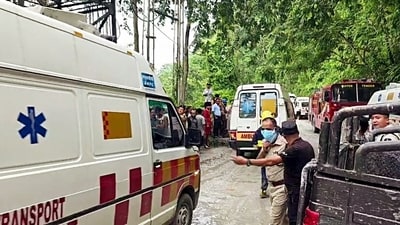 Ambulances and fire engines rush to the scene after the Samardong Tunnel collapsed, trapping 27 workers, in Namche on Monday. (Sikkim Police) Ambulances and fire engines rush to the scene after the Samardong Tunnel collapsed, trapping 27 workers, in Namche on Monday. (Sikkim Police)