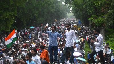 Activists and supporters of the Cockroach Janta Party (CJP) gather to take part in a protest demanding the resignation of education minister Dharmendra Pradhan over alleged NEET exam irregularities in New Delhi on July 20, 2026 (AFP) Activists and supporters of the Cockroach Janta Party (CJP) gather to take part in a protest demanding the resignation of education minister Dharmendra Pradhan over alleged NEET exam irregularities in New Delhi on July 20, 2026 (AFP)