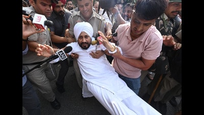 Congress’ Jalandhar MP and former Punjab chief minister Charanjit Singh Channi being detained by the Delhi Police on Tuesday. (RAJ K RAJ /HT PHOTO)