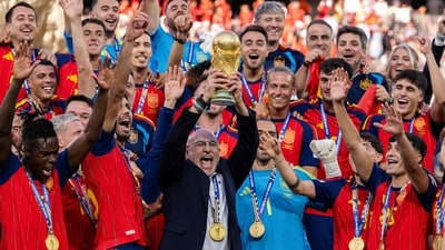 Luis de la Fuente, Head Coach of Spain, lifts the FIFA World Cup Winner's Trophy after the team's victory following the FIFA World Cup 2026 Final match (Getty Images via AFP)