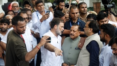 Rahul Gandhi talks with Jitendra Singh, Minister of State, PMO, during a sit-in protest outside Prime Minister Narendra Modi's residence, demanding accountability for police action against students, in New Delhi, India, July 21, 2026. (REUTERS)