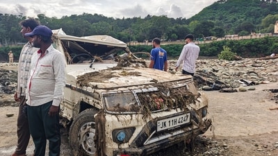 A damaged car lies in an area filled with debris after landslides and heavy rains in Rajouri, Jammu and Kashmir. (PTI)