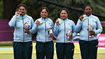Lawn bowl gold medalists Lovely Choubey, Pinki, Nayanmoni Saikia and Rupa Rani Tirkey of Team India pose with their medals at the Birmingham 2022 Commonwealth Games. (Getty Images)