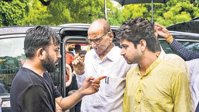 NCP (SP) president Sharad Pawar interacts with Cockroach Janata Party (CJP) founder Abhijeet Dipke at Jantar Mantar. (PTI) NCP (SP) president Sharad Pawar interacts with Cockroach Janata Party (CJP) founder Abhijeet Dipke at Jantar Mantar. (PTI)