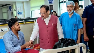 Union Health Minister JP Nadda reacts to a person who was injured during a protest on Monday. (PTI)