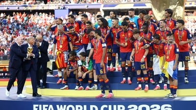 U.S. President Donald Trump and FIFA President Gianni Infantino hands the World Cup trophy to Spain's Rodri ahead of the trophy lift (REUTERS)